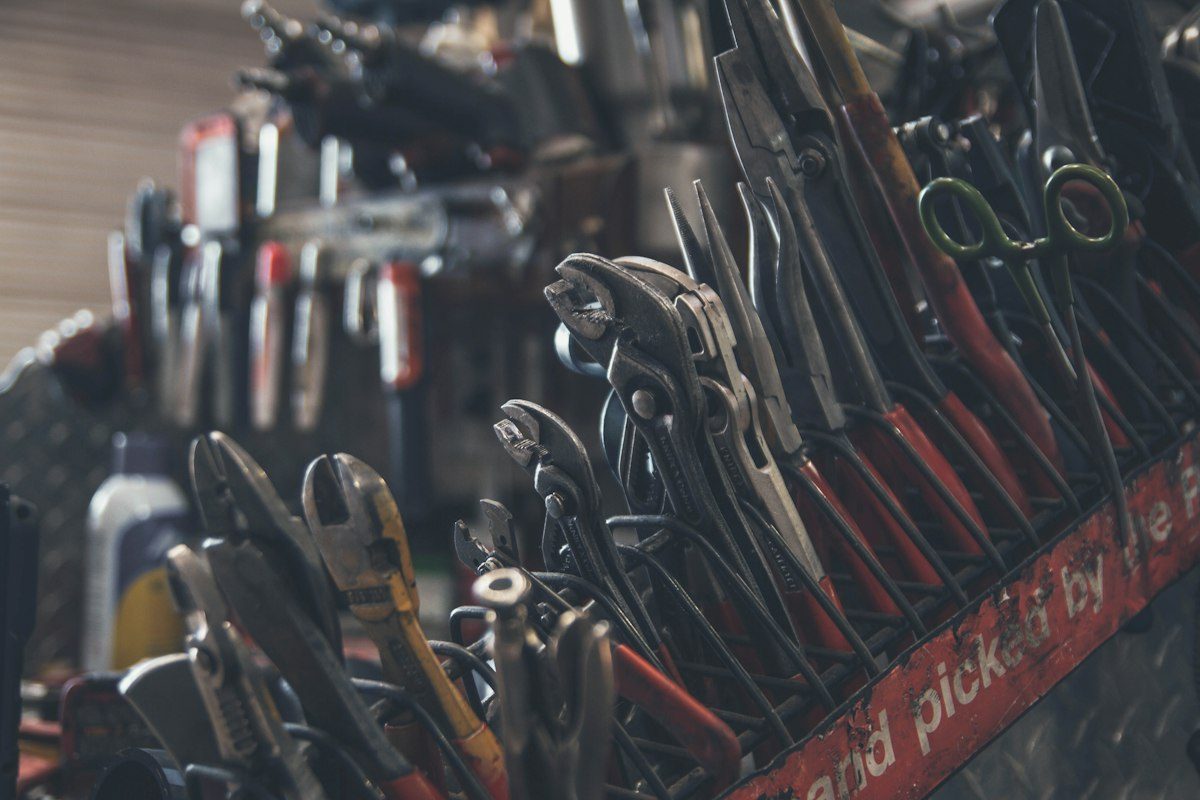 Professional pliers and cutters in a workshop rack